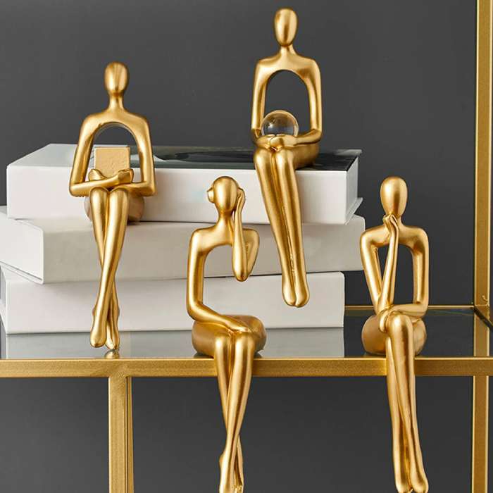 Gullfargede abstrakte figurer