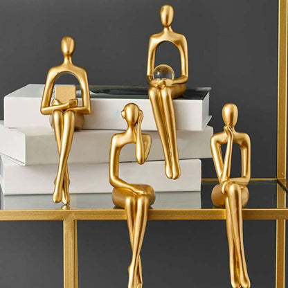 Gullfargede abstrakte figurer