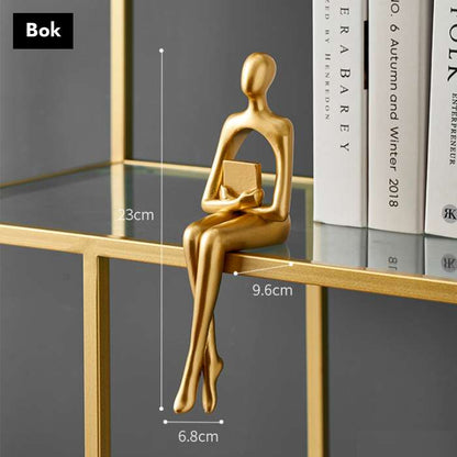 Gullfargede abstrakte figurer