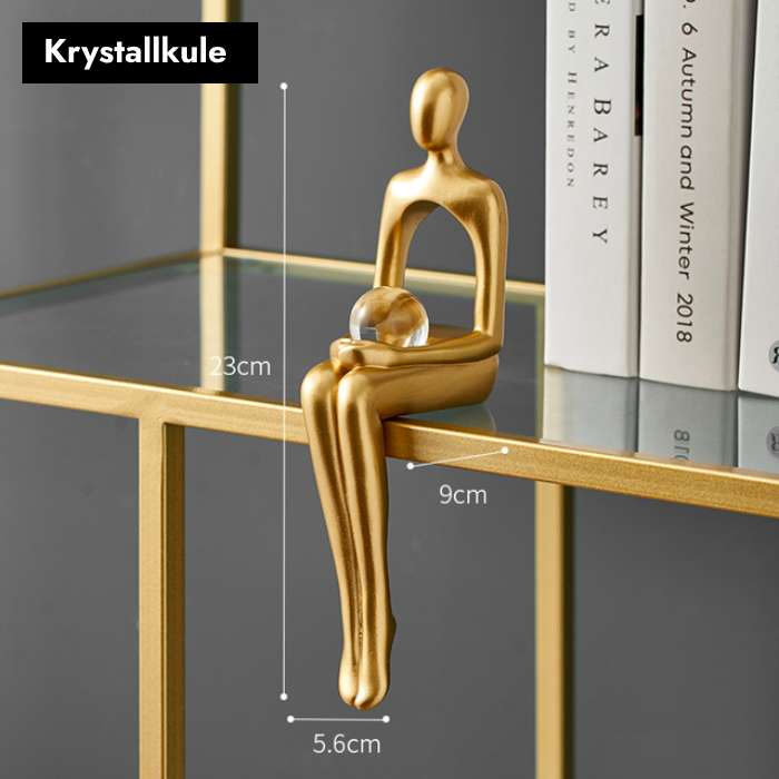 Gullfargede abstrakte figurer