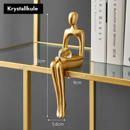 Gullfargede abstrakte figurer