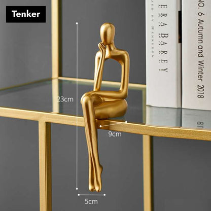 Gullfargede abstrakte figurer